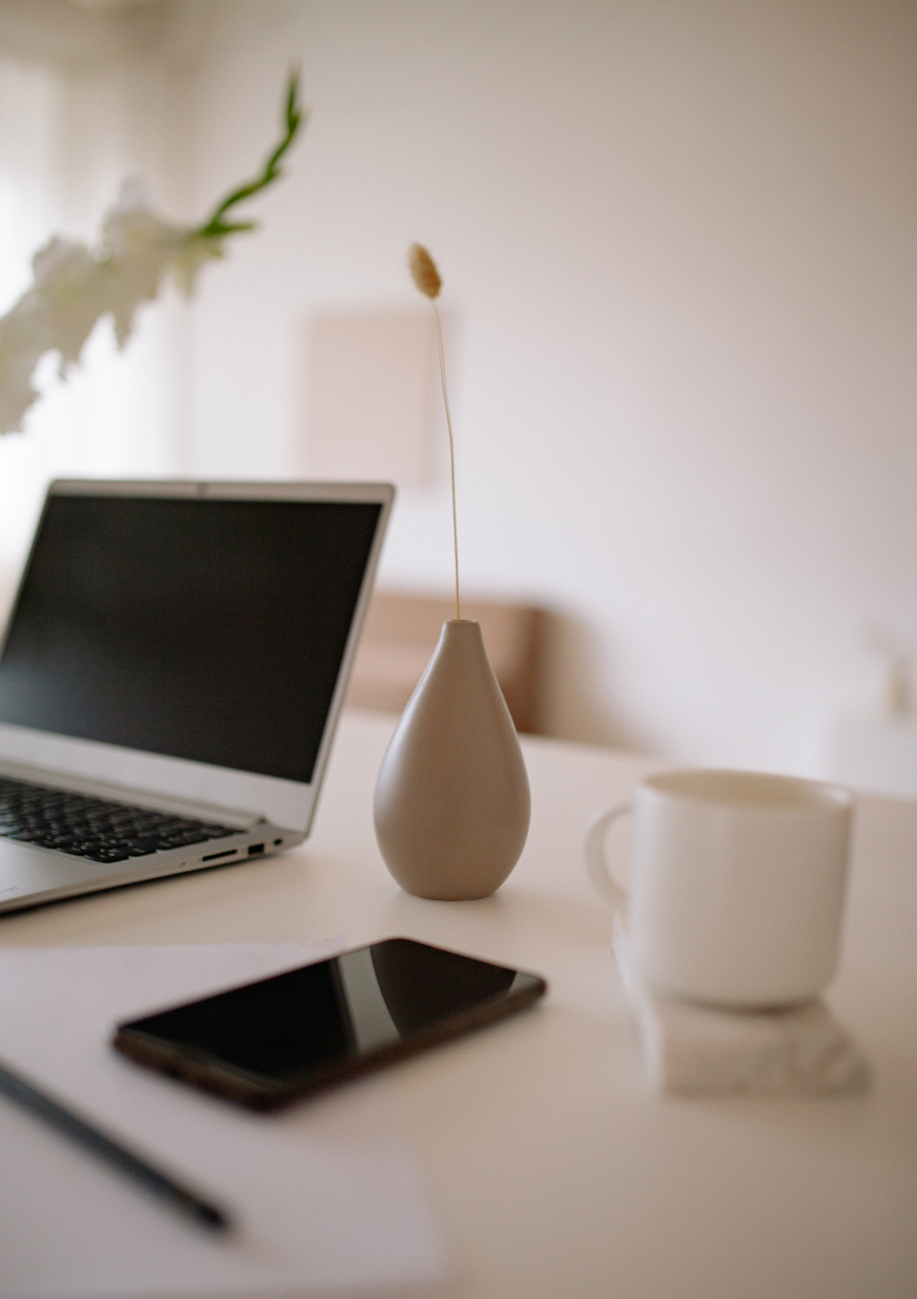 elegant minimalist laptop and phone respresenting website design and responsiveness